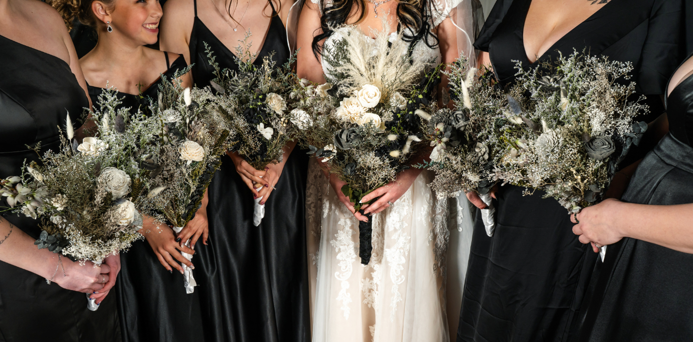 Close-up of the bridal party bouquets, showcasing the floral arrangements at an Oshkosh wedding, captured by a professional wedding photographer.