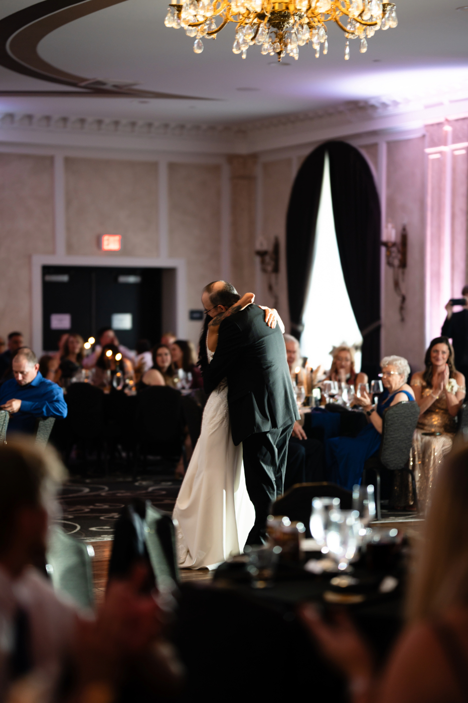 Bride sharing an emotional father-daughter dance with her father at the elegant Hotel Retlaw in Fond Du Lac, Wisconsin